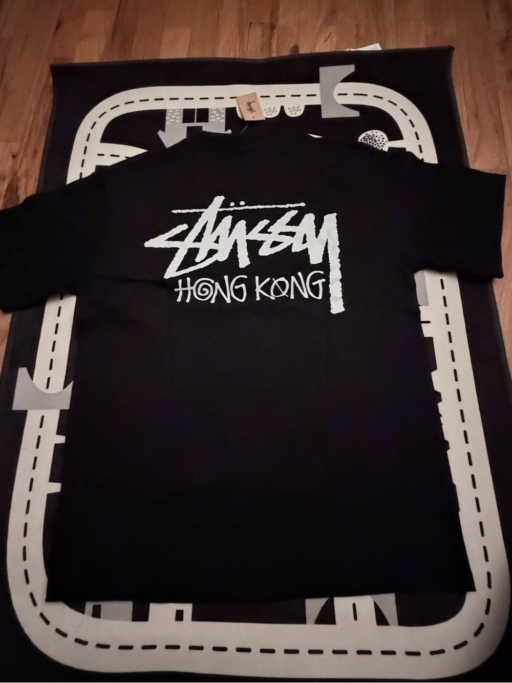 Stussy Black T-Shirt with White "Hong Kong" Graphic